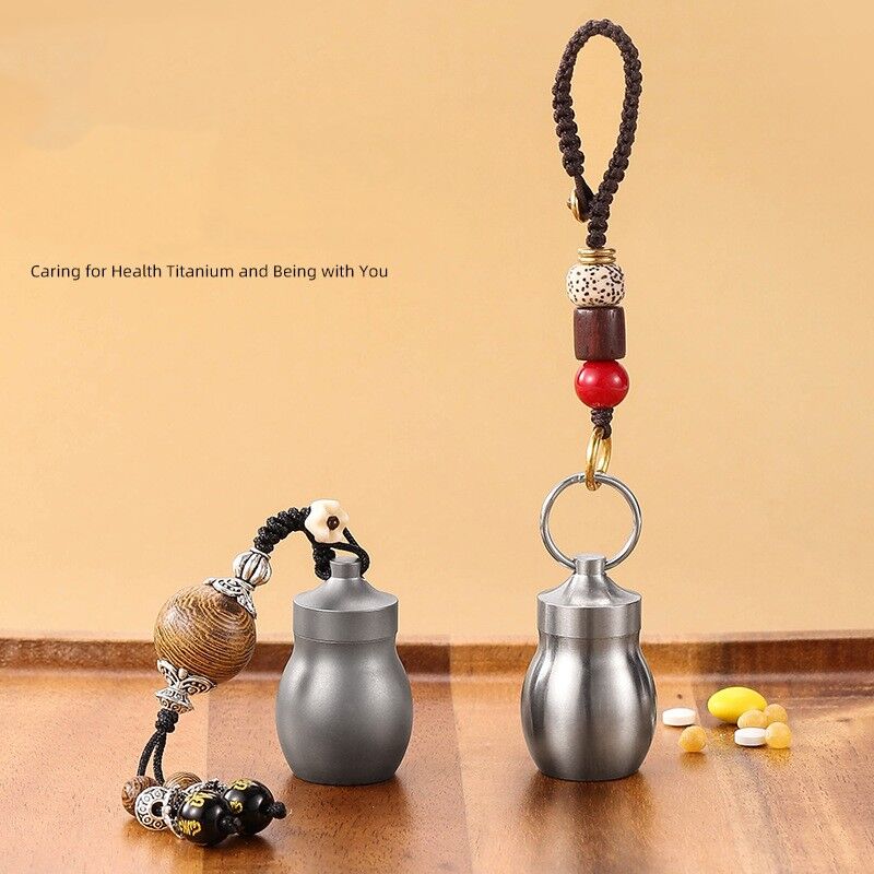 titanium waterproof pill capsule with hand strap titanium waterproof pill capsule with hand strap